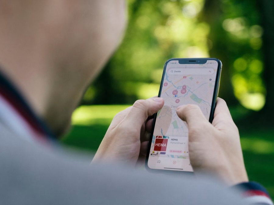 Field sales representative using the Travelling Salesman app on a phone